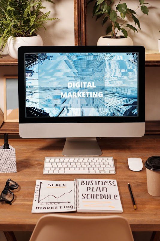 Computer displaying text that reads “digital marketing.”