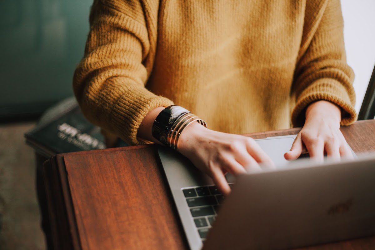 A transcriptionist inputting information into a computer