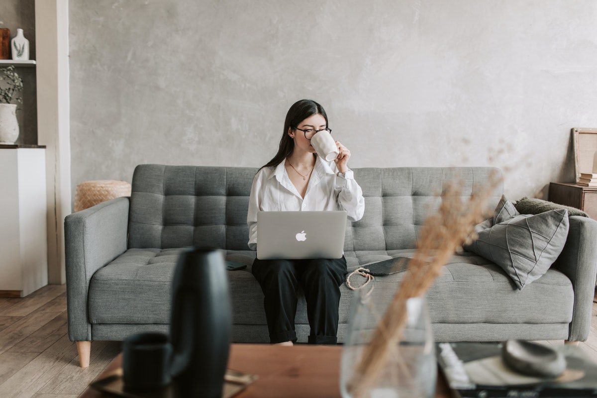 An employee working from home while enjoying a cup of coffee. Advertising Portfolio