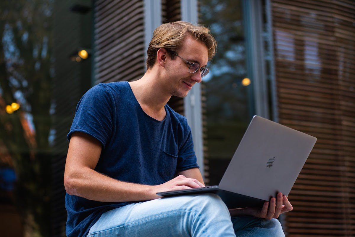 An engineer using his laptop to work on his profitable side hustle