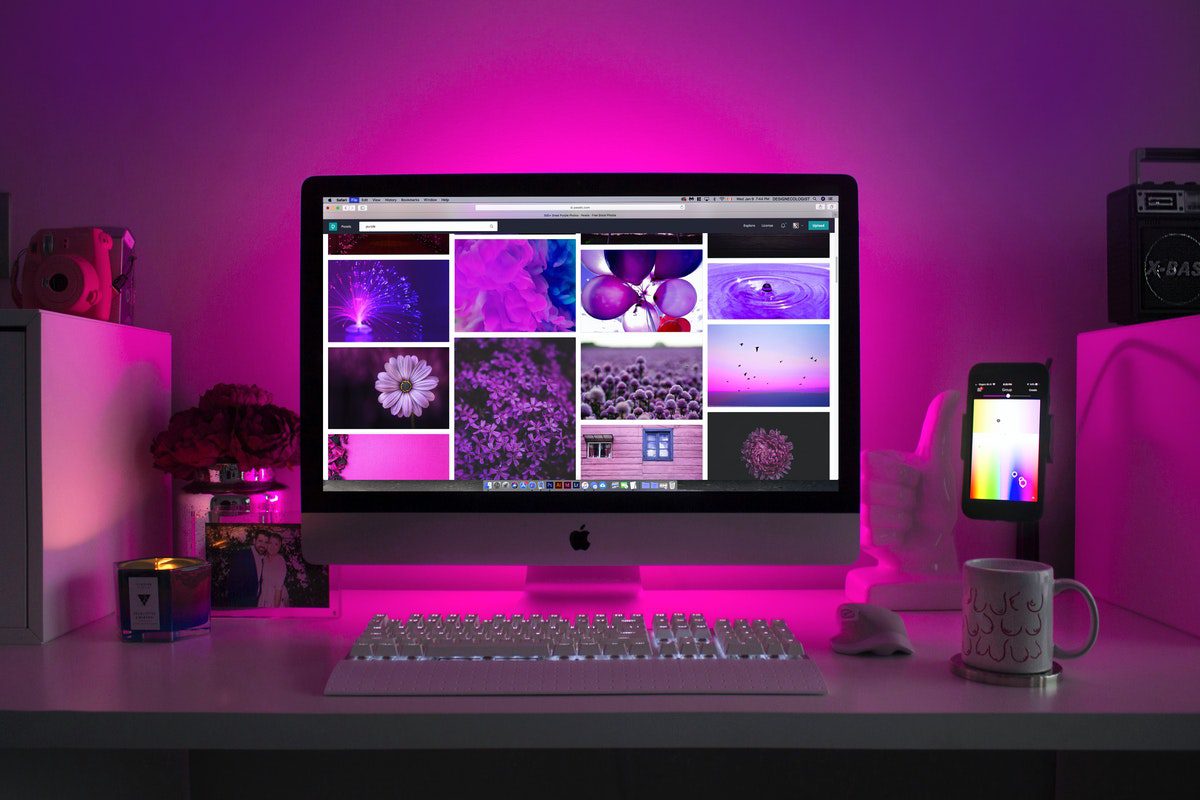 An iMac displaying various images and designs. Best Web Design Blogs