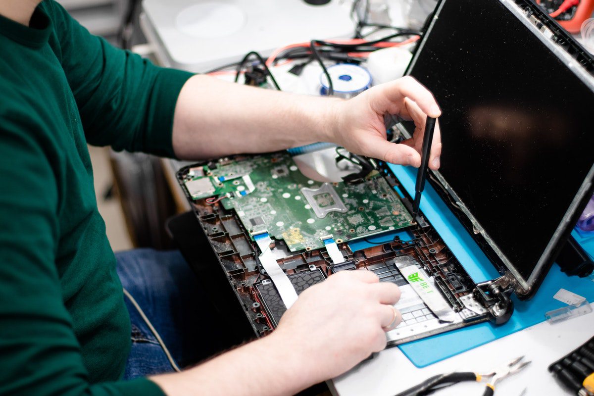 A man building a laptop from scratch