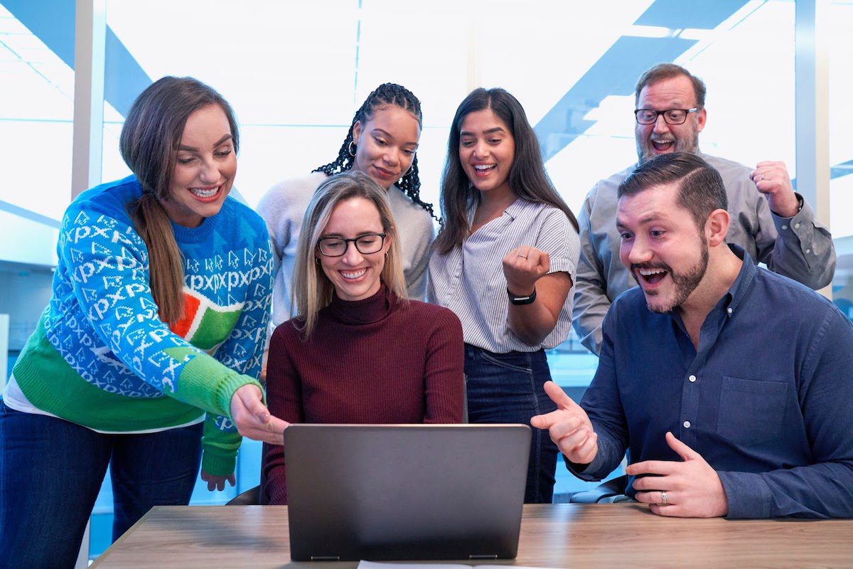 Colleagues working together with a laptop