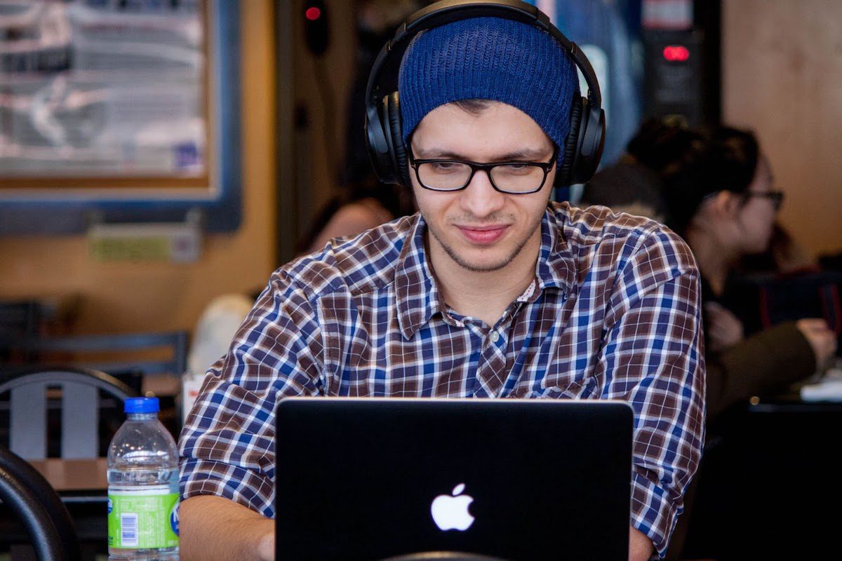 A picture of a man working on his laptop