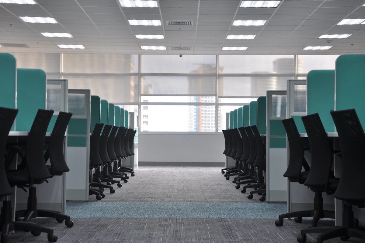 Black rolling chairs in an empty office space for full-time employees IBM Benefits: Perks of Working at IBM 