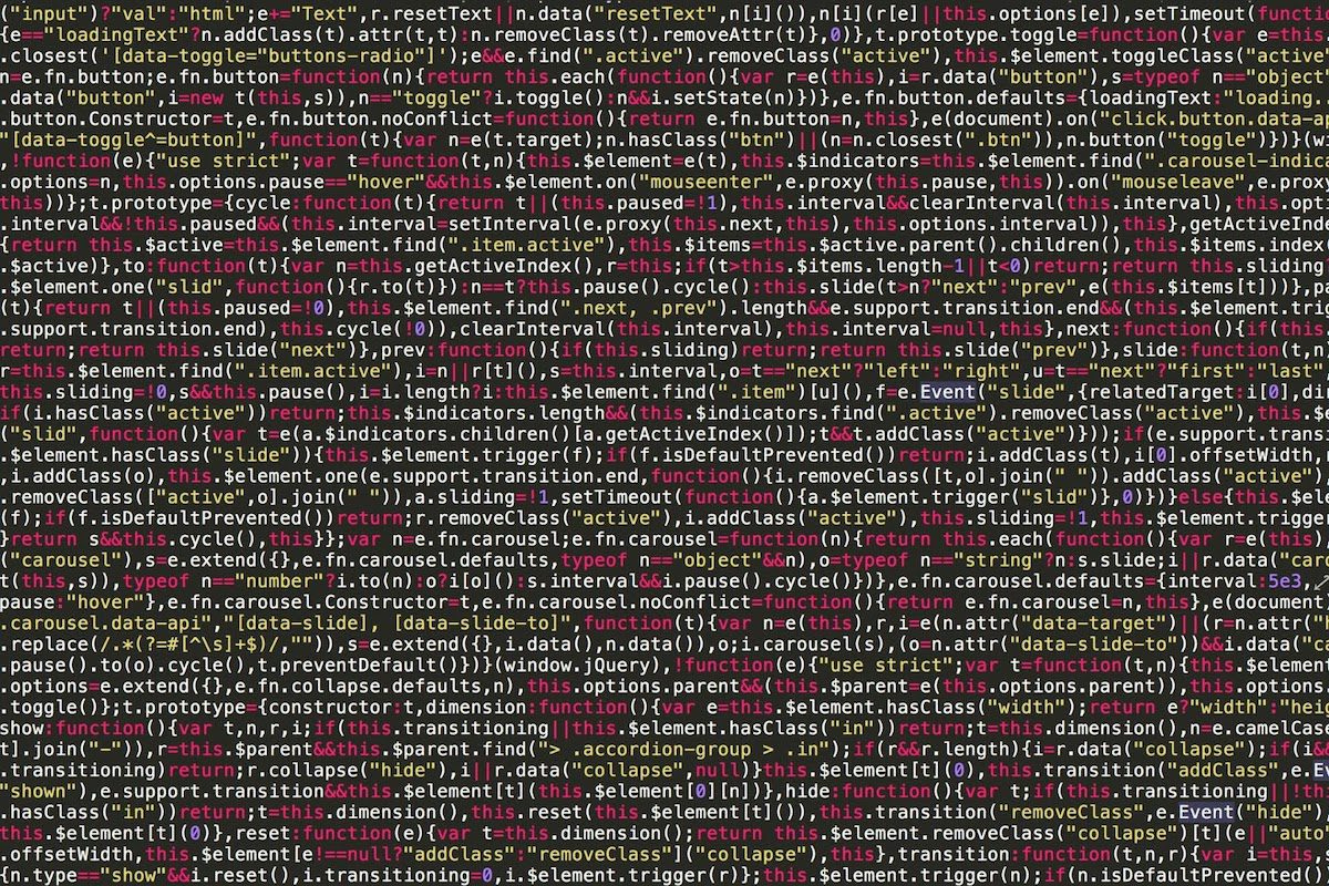 A screen showing many lines of colorful code.