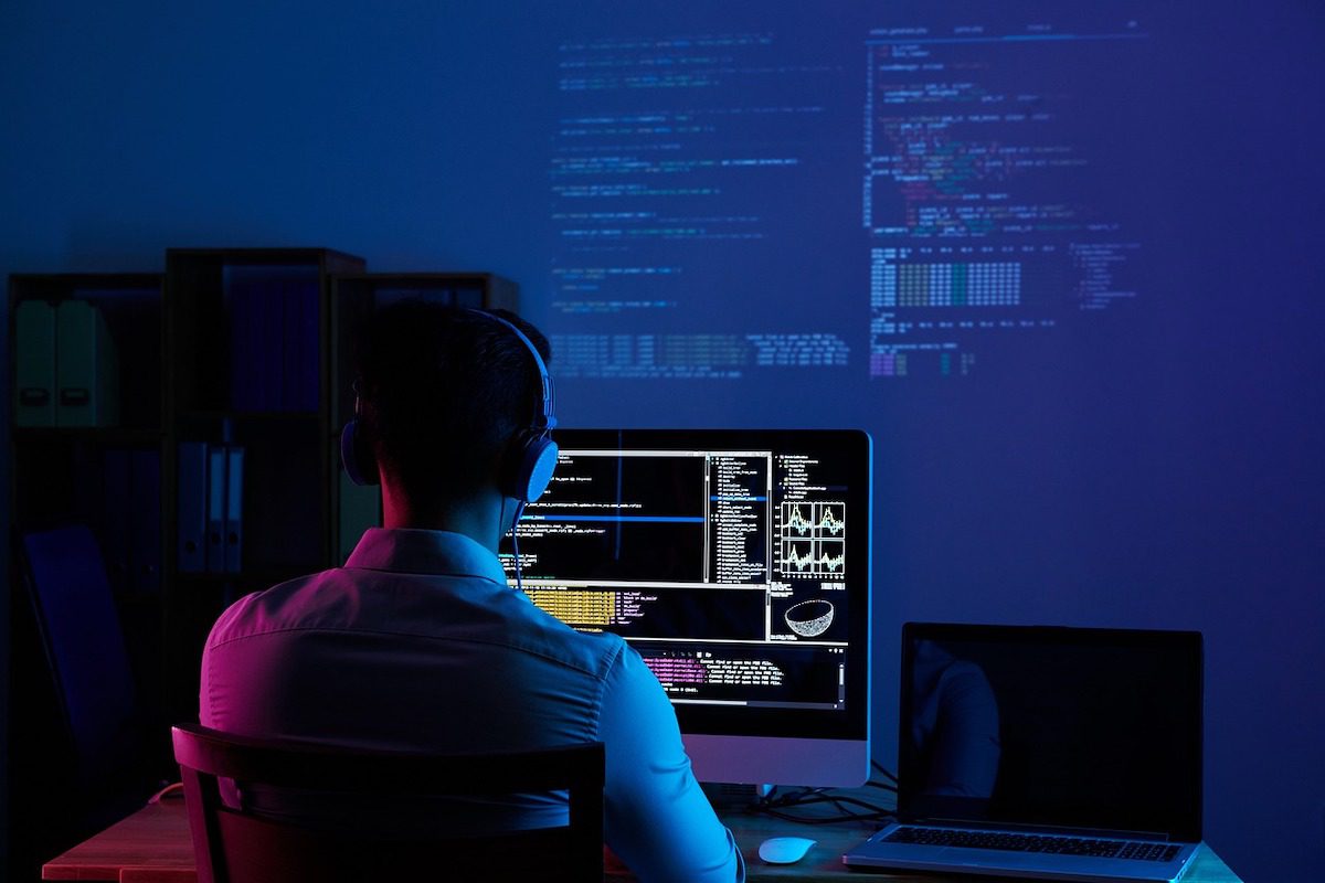 A software engineer working on a computer.