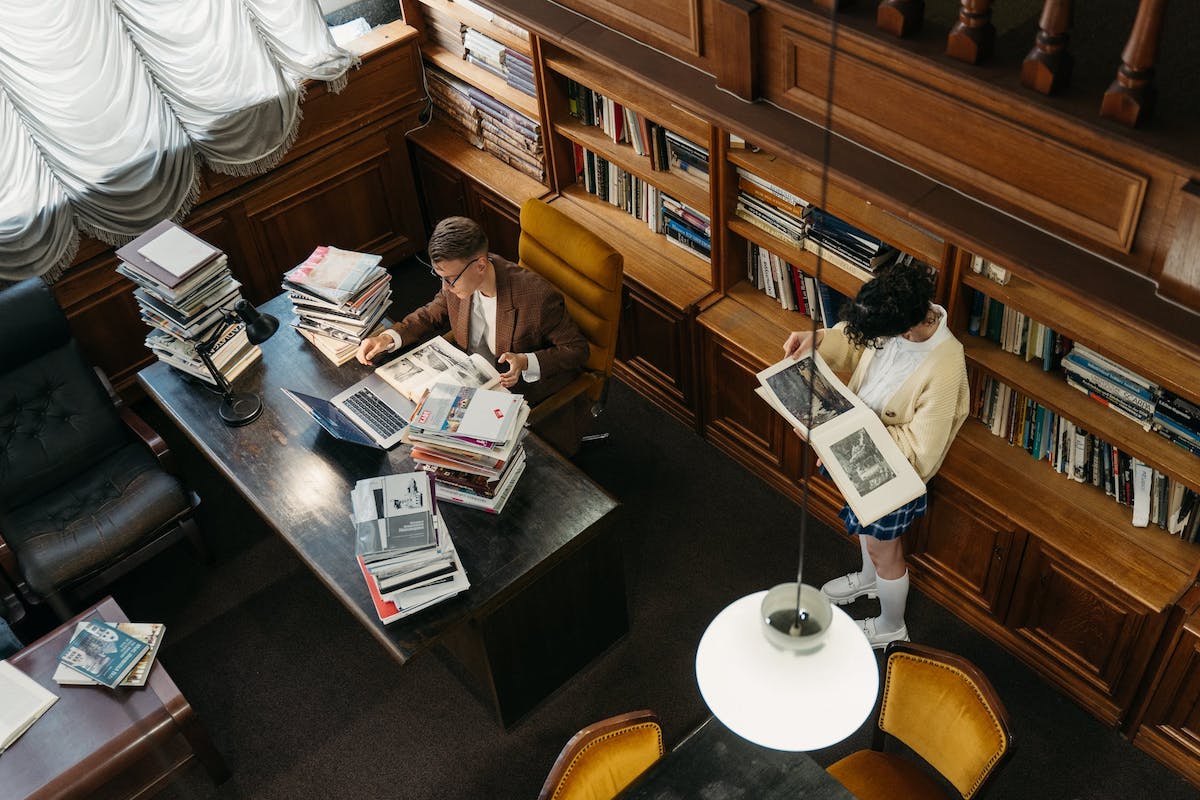 Students studying in a library Accelerated Masters Degrees