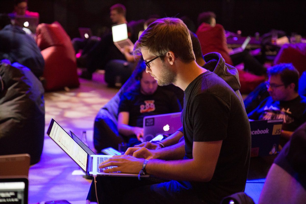 A student working on his laptop. A Day In The Life Of A Software Engineer