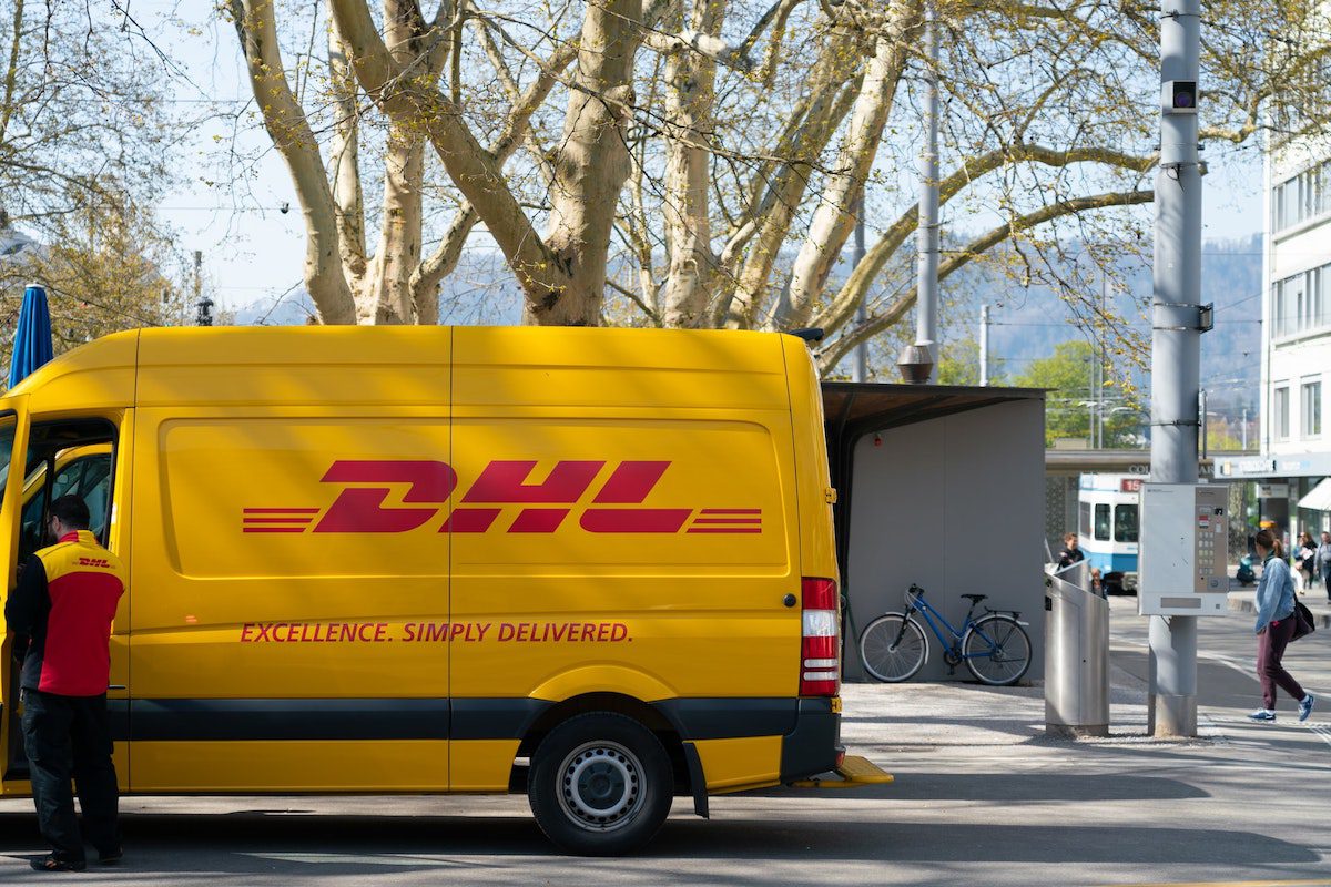 A delivery service driver standing outside a DHL truck. Jobs That Require a Driver's License