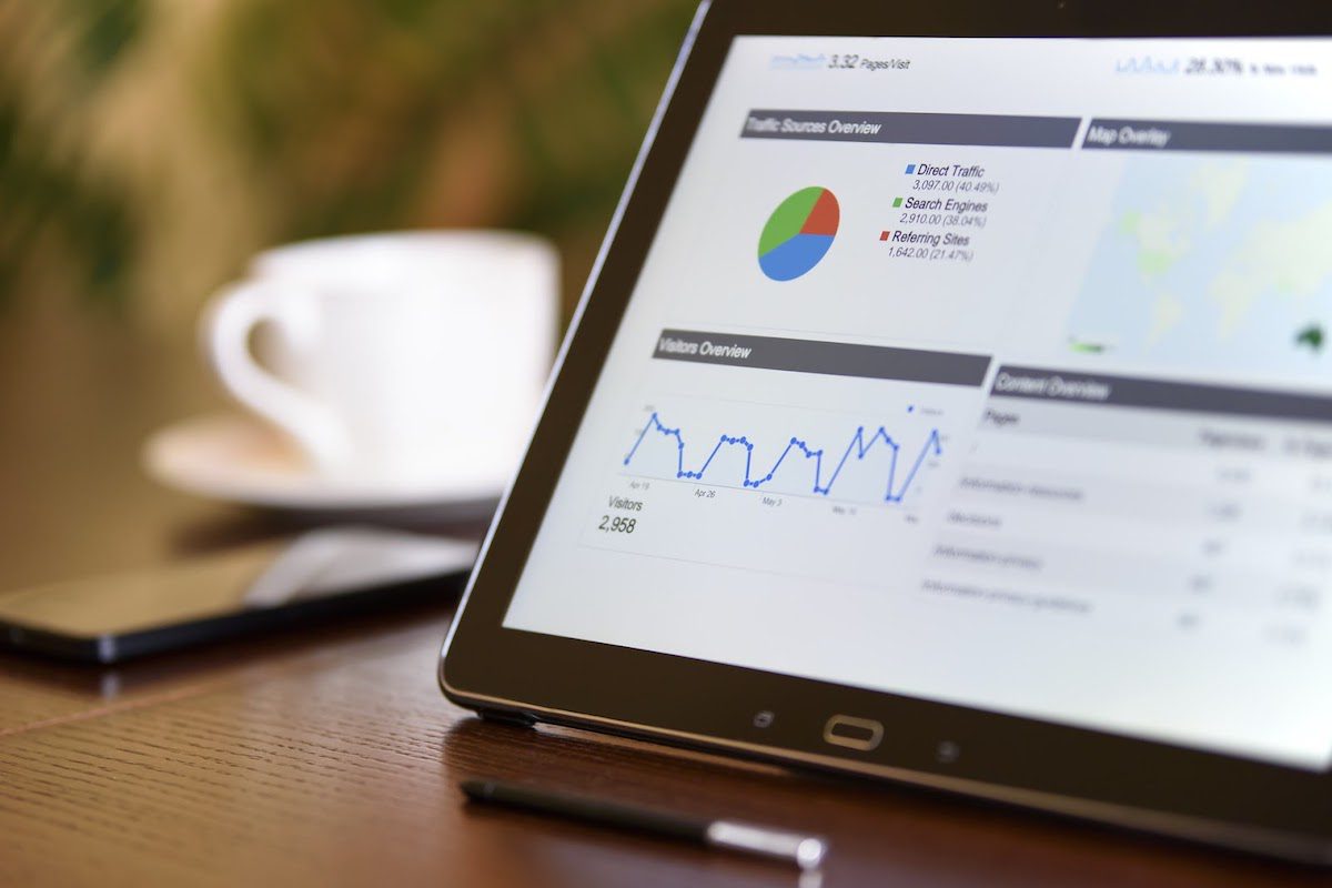 A tablet on a table showing a data analysis graph.