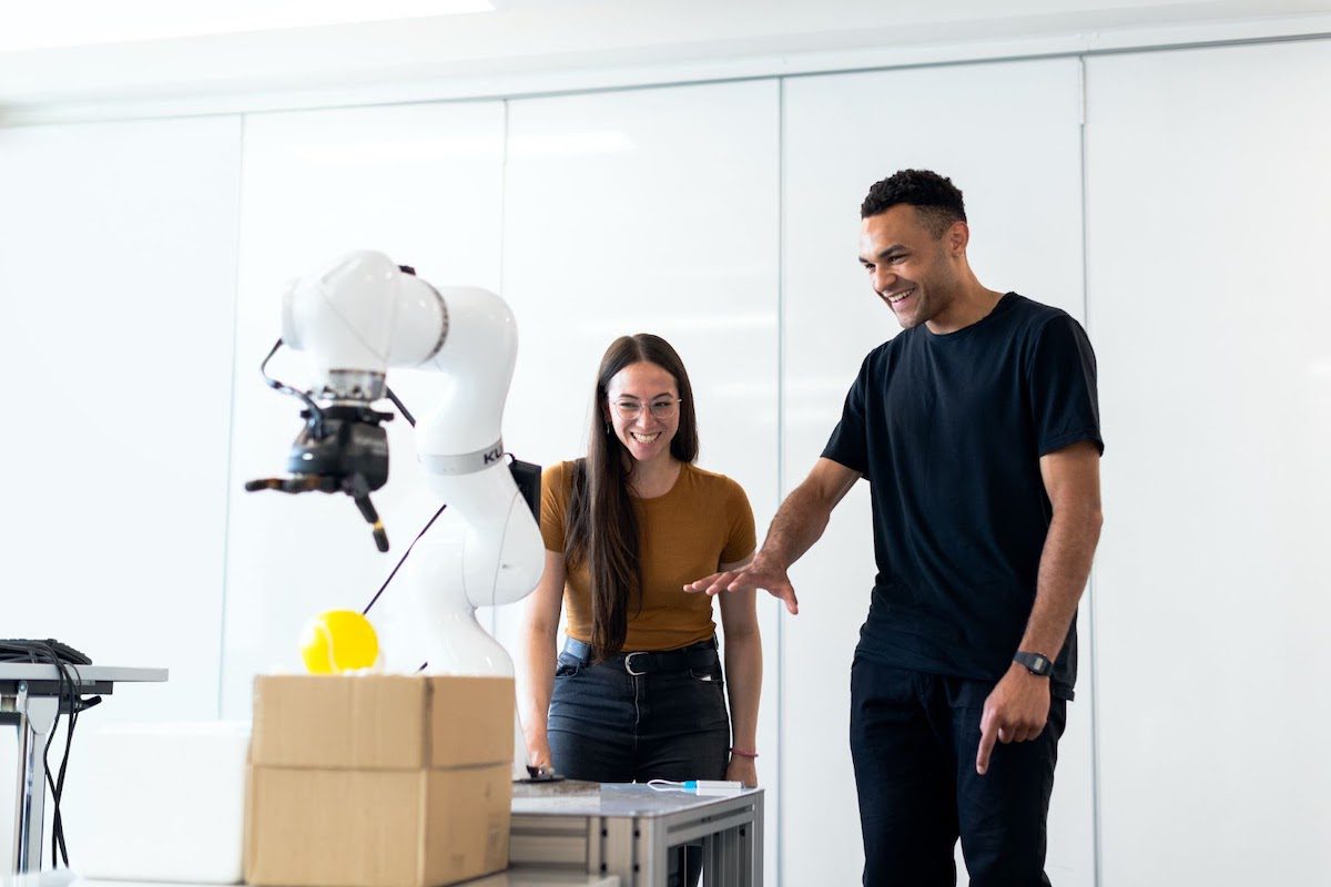 Tech professionals analyzing robotic equipment