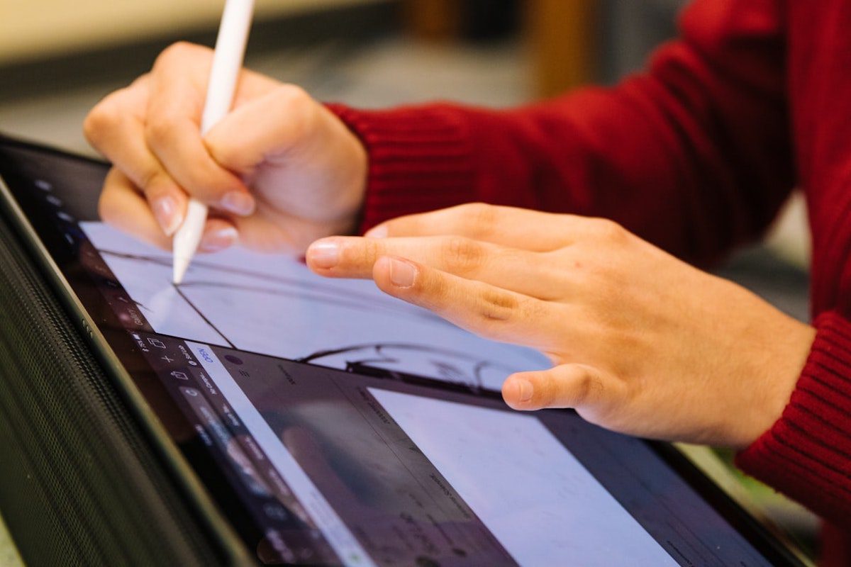 A person drawing on a digital canvas. Jobs That Use Math