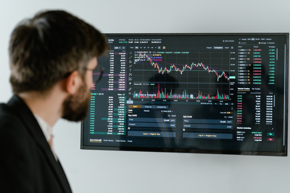 A data entry specialist observing graph data on a screen. Junior Vs Senior Data Entry Specialists