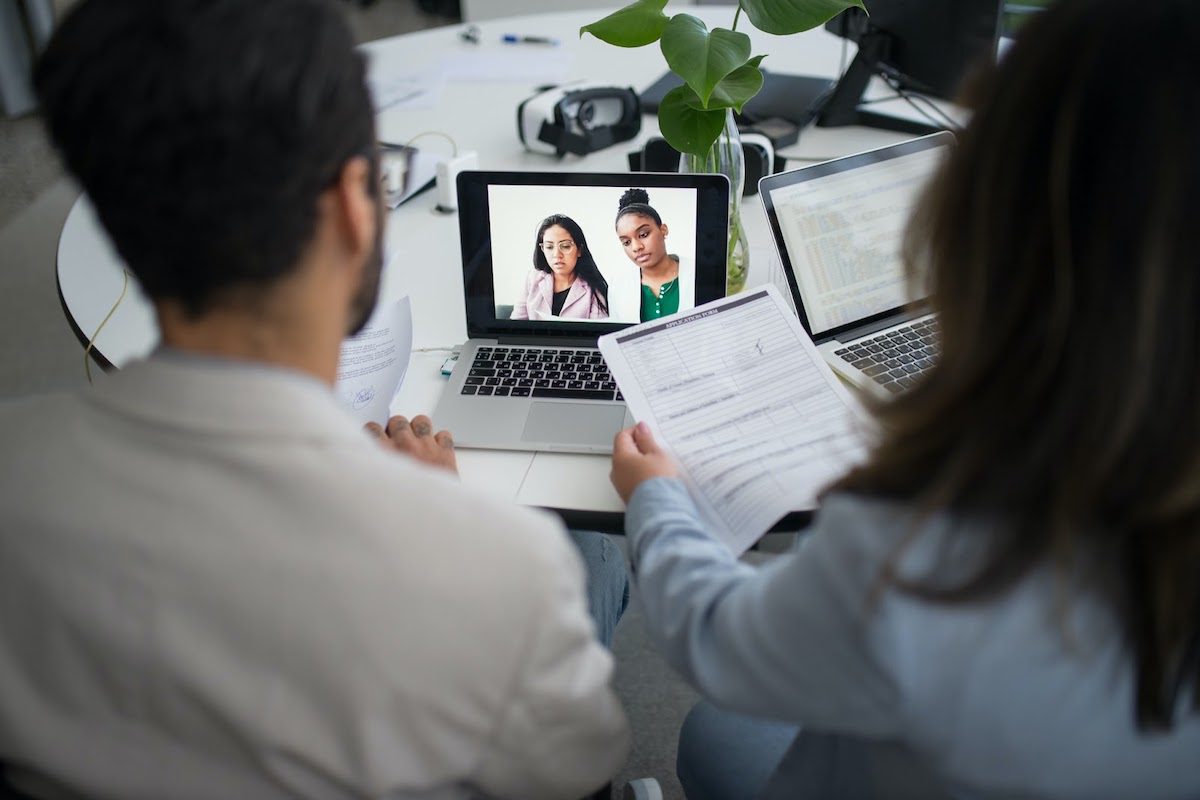 A group of students holding an online interview. 