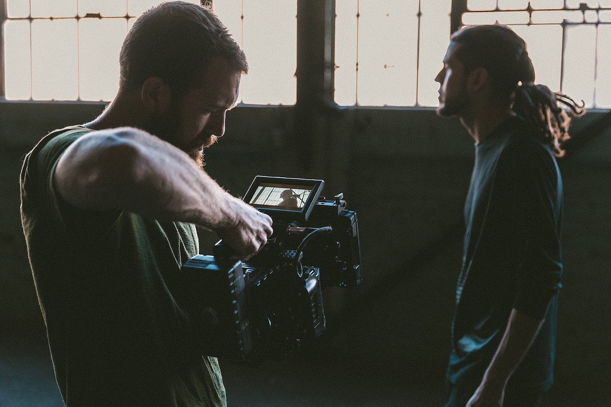 A videographer and a male actor recording a movie scene. How To Get Into Film School