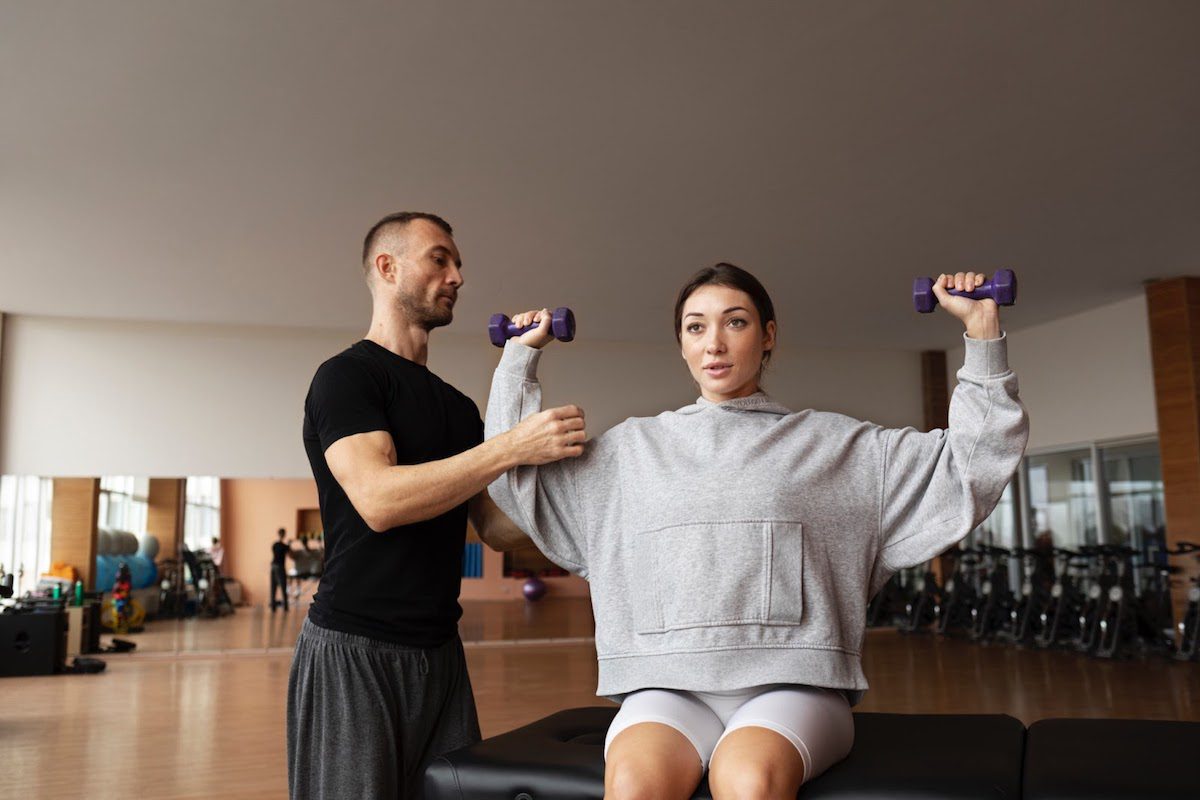 A physical therapist helping a patient exercise 