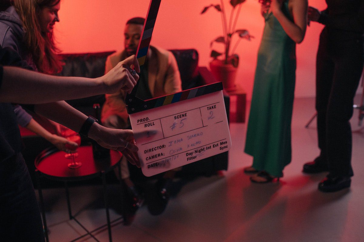 A filmmaker holding a clapperboard