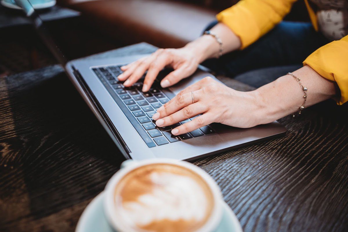 Hands typing on a keyboard