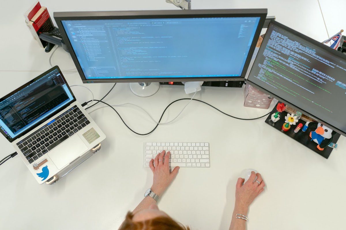 A software engineer coding on computers