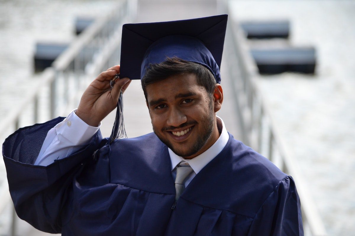 A smiling student. Accelerated Business Degrees
