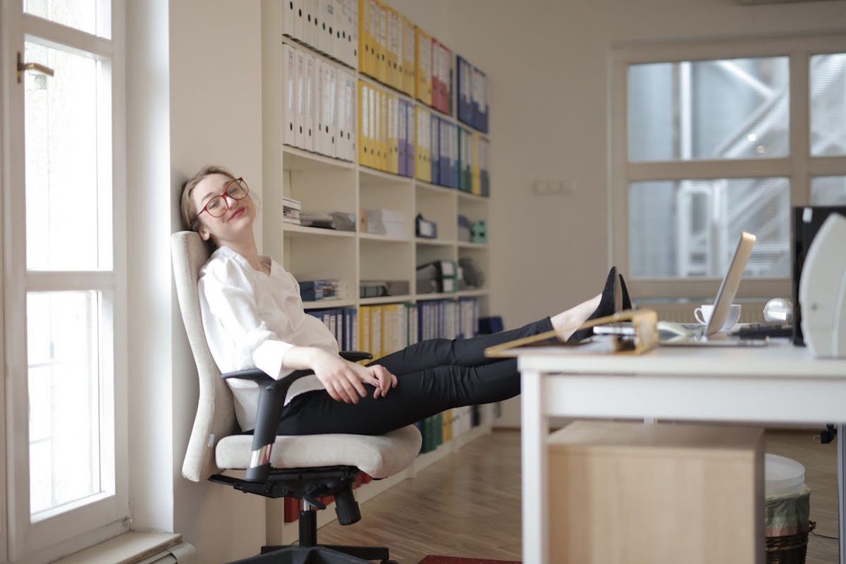  Relaxed female secretary with feet on a desk in the workplace Highest-Paying Jobs in Maine