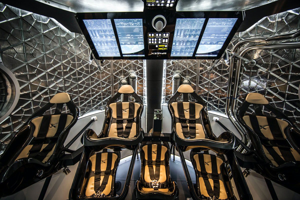 The inside of a modern, well-designed spacecraft with navigational computer monitors