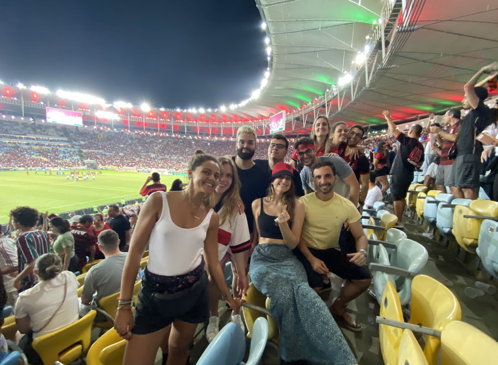 Students of Le Wagon Rio watch a soccer game together in Maracana 