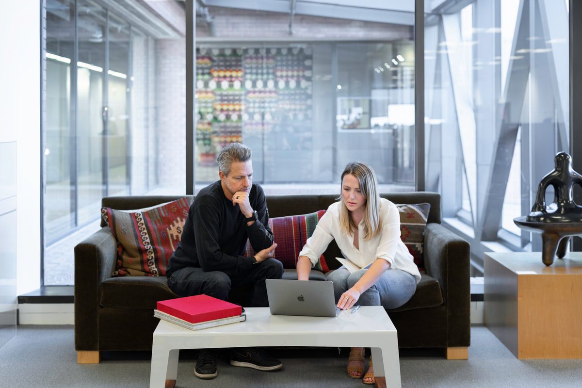 Two real estate developers discussing a project in an office