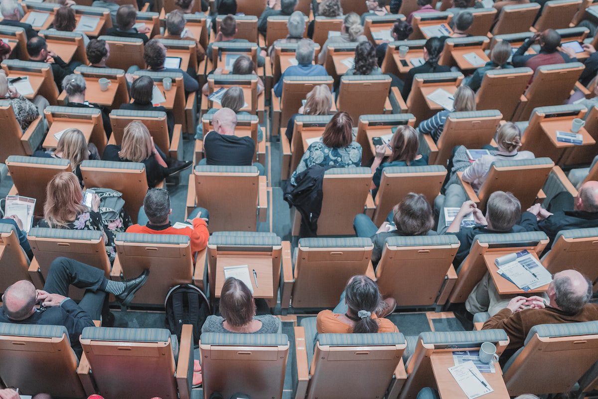 Students in a lecture room attending an on-campus academic program.