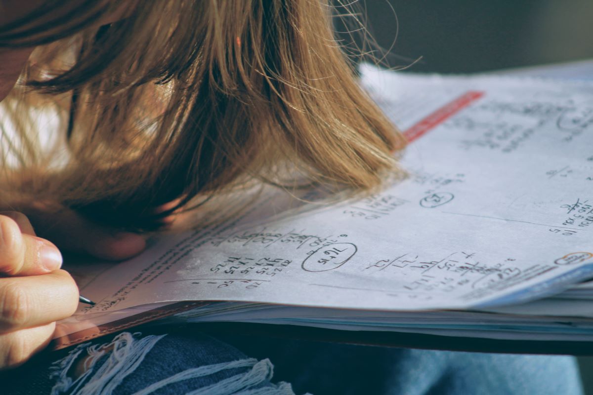 A student doing math calculations. 