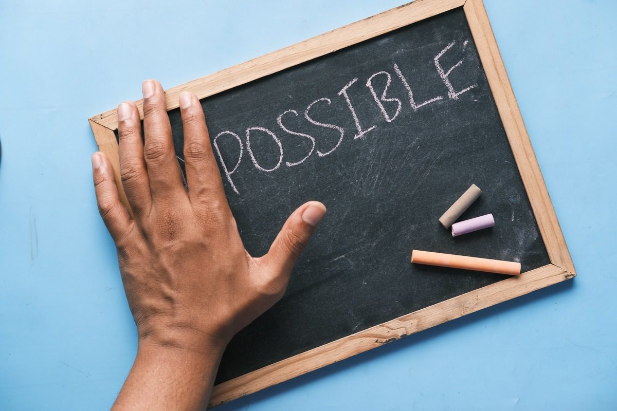 A chalkboard with the word possible written on it.