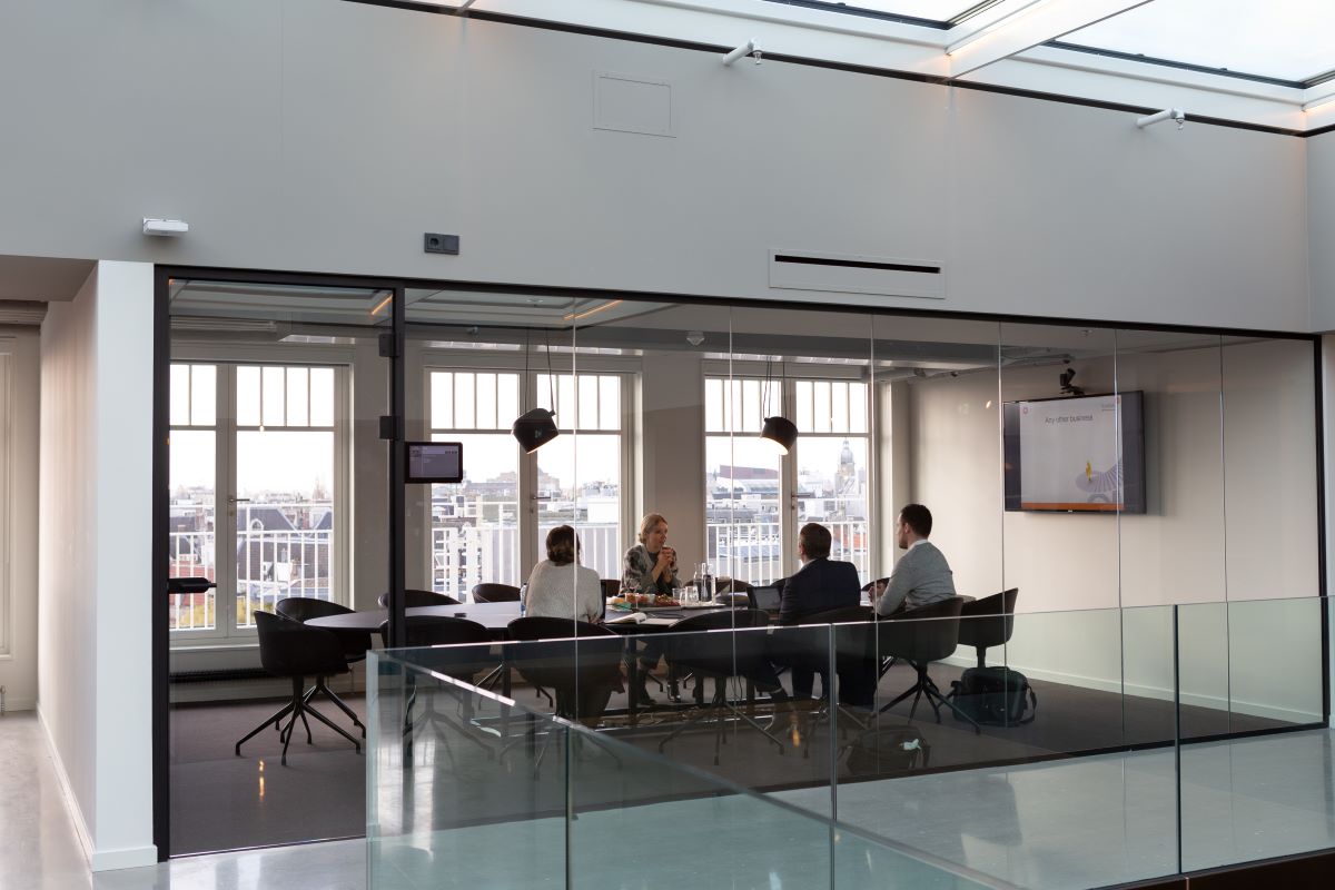 Business executives having a meeting in a conference room.