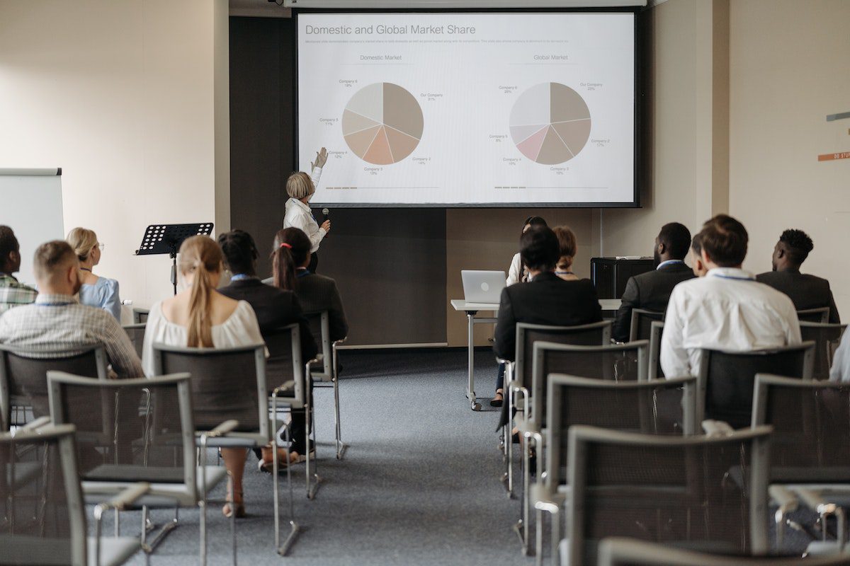 A lecturer is teaching in a classroom