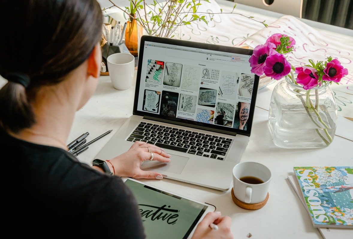 A women working as a freelance web developer on a laptop.