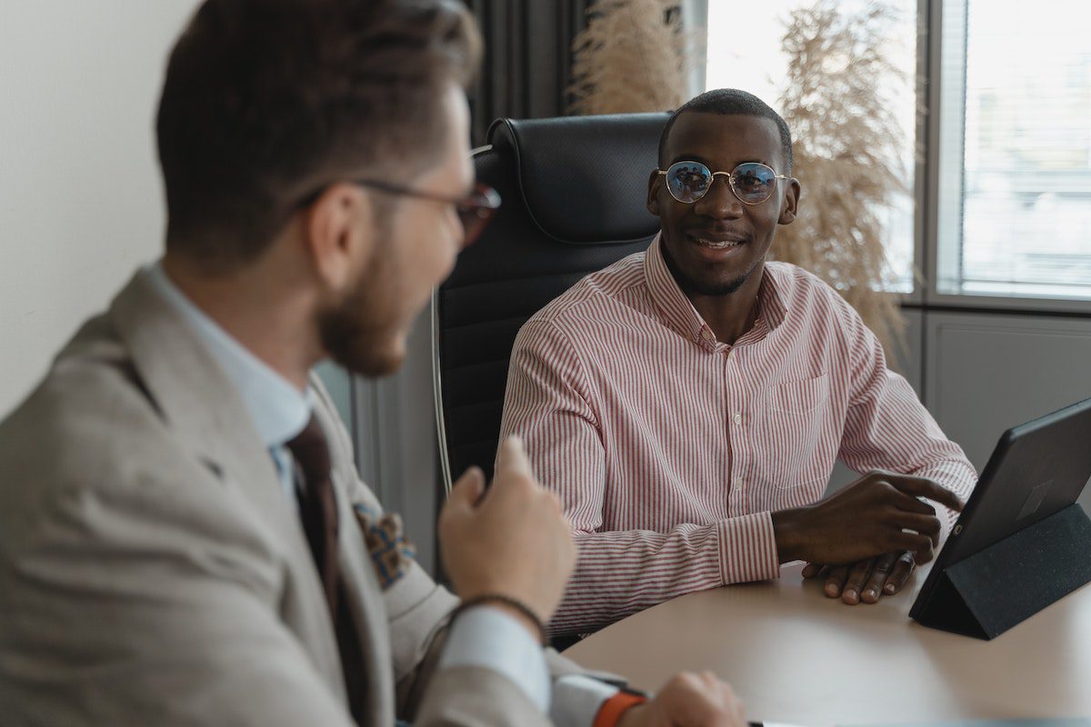 A candidate in a striped shirt interviewing for a data science apprenticeship job. 
